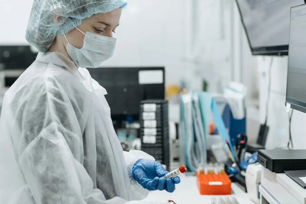 Diagnostics laboratory products - lab technician with tube