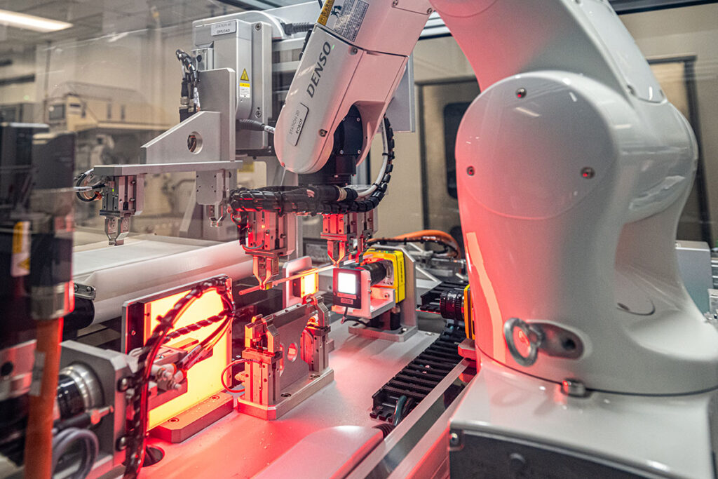 High-speed robotic arm performing automated medical assembly