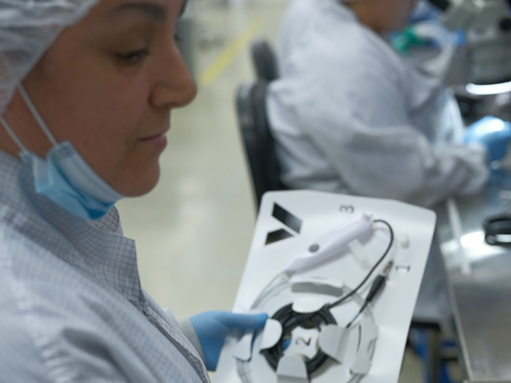 Lab technician performing seal strength and dye penetration testing
