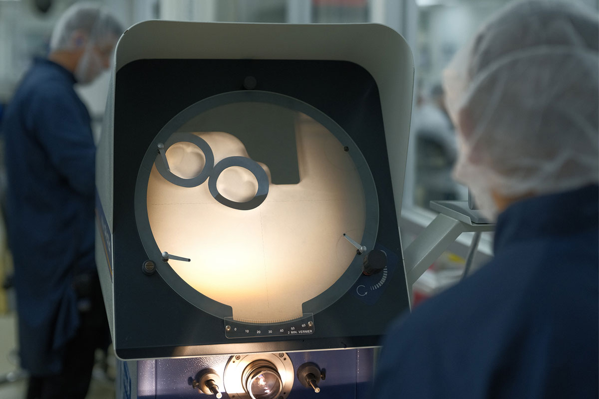 Viant medical extrusion specialists monitoring high-precision catheter tubing line